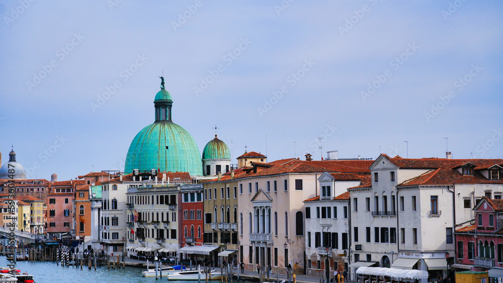 Narrow canal with bridge in Venice, Italy. Architecture and landmark of Venice. Cozy cityscape of Venice.