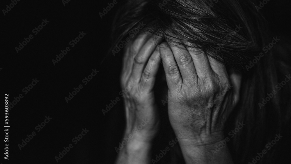 Close up of depressed senior woman holding her head. Close up of depressed senior woman holding her head.