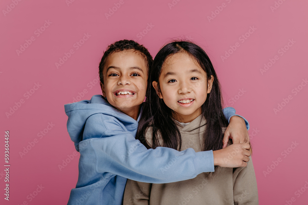 Portrait of two children, studio shoot. Concept of diversity in friendship. Portrait of two children, studio shoot. Concept of diversity in friendship.