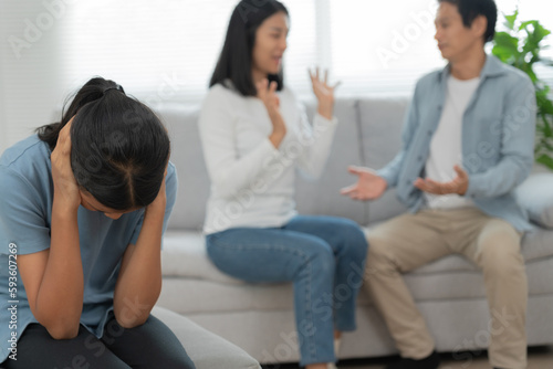 problem in family. daughter use hands cover your face and feel stressed from the parents quarrel. child is have mental problem. quarrels, violence, depression, suicide, discouragement, social problem