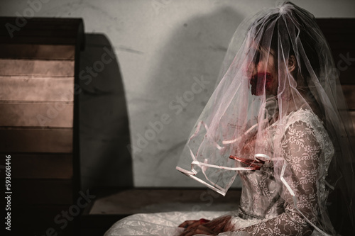 Halloween festival concept,Asian woman makeup ghost face,Bride zombie charactor,Horror movie wallpaper or poster © reewungjunerr