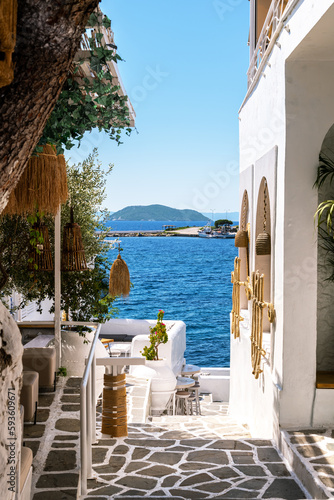 Fototapeta Naklejka Na Ścianę i Meble -  Gateway to the sea in a Greek cafe.