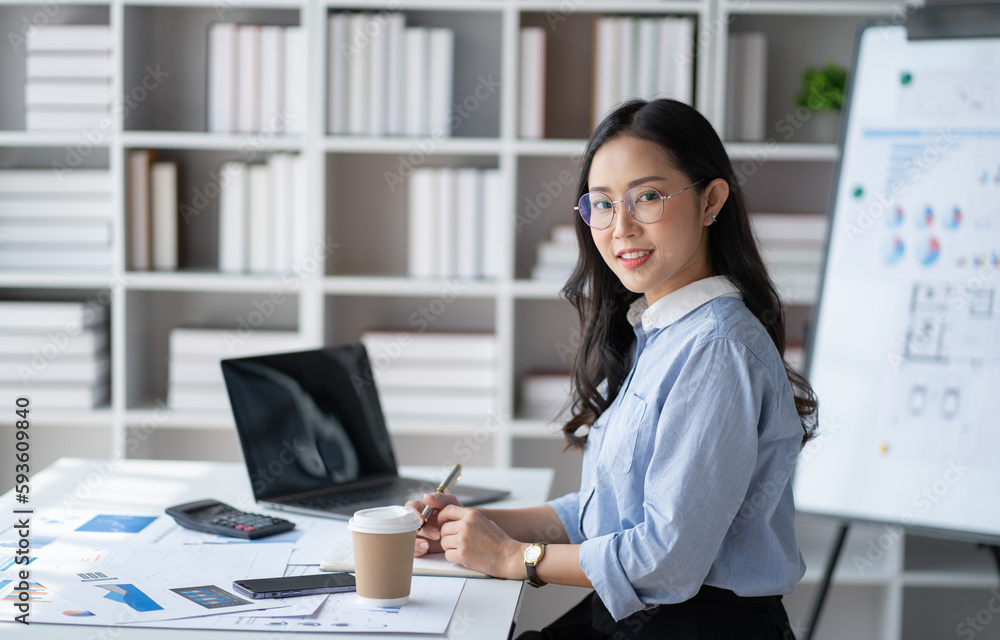 Portrait of young beautiful Asian businesswoman working in her office room. Portrait of young beautiful Asian businesswoman working in her office room.
