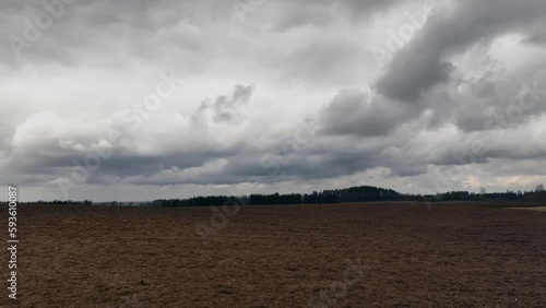 cloudy sky plowed field landscape spring season