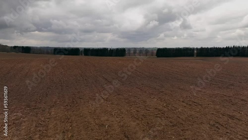 Cloudy sky plowed field landscape spring season
