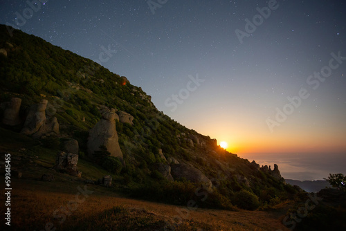 ghost valley on mountain demerdzhi and moonrise at night photo
