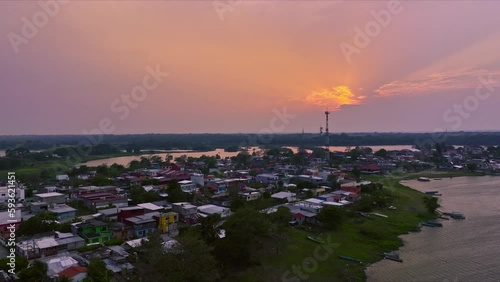 Drone made sunset with the sun behind the clouds and reflections on water HLG edited