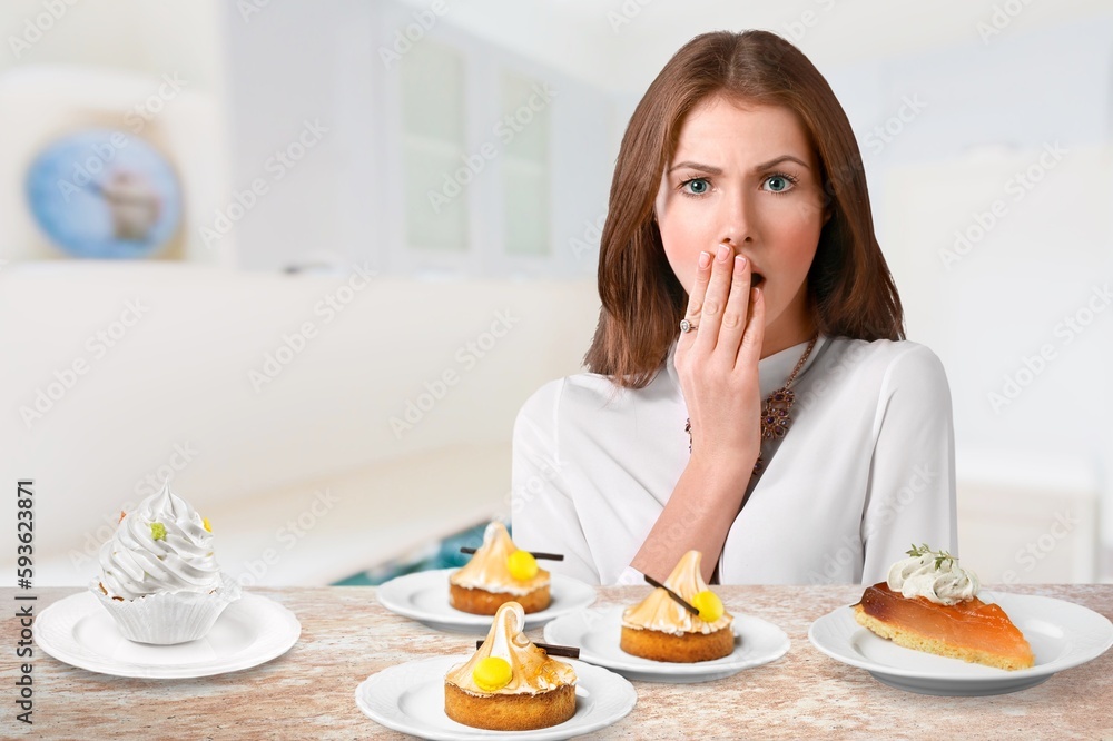Funny young woman eating tasty sweet cake Funny young woman eating tasty sweet cake