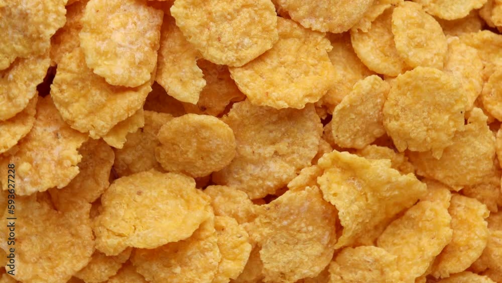 corn flakes, rotation in circle. yellow healthy crispy breakfast Turning. selective focus corn flakes, rotation in circle. yellow healthy crispy breakfast Turning. selective focus