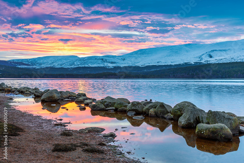An early spring morning at Loch Morlich for a wonderful colourful sunrise in the Cairngorms National Park, Scotland