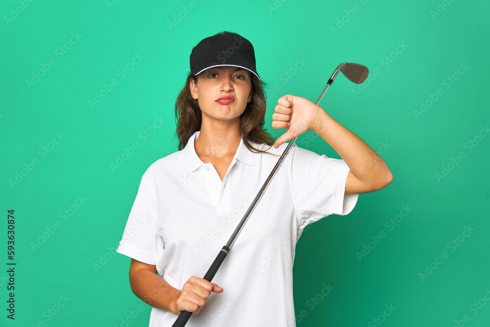Young caucasian golfer holding a golf stick isolated Young caucasian golshowing a dislike gesture, thumbs down. Disagreement concept. Young caucasian golfer holding a golf stick isolated Young caucasian golshowing a dislike gesture, thumbs down. Disagreement concept.