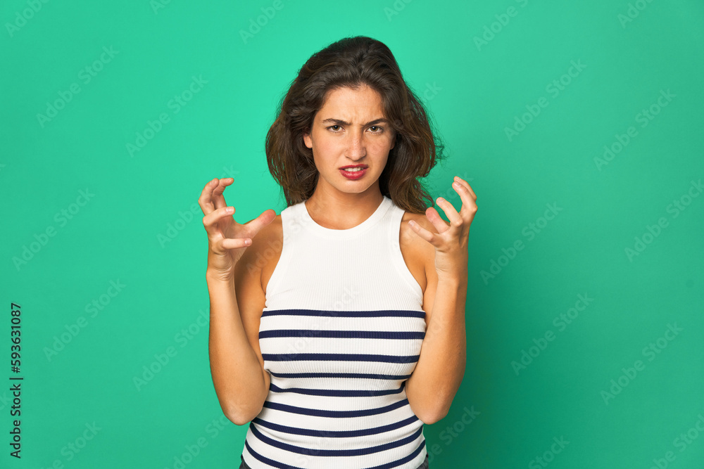 Young caucasian woman isolated screaming with rage. Young caucasian woman isolated screaming with rage.