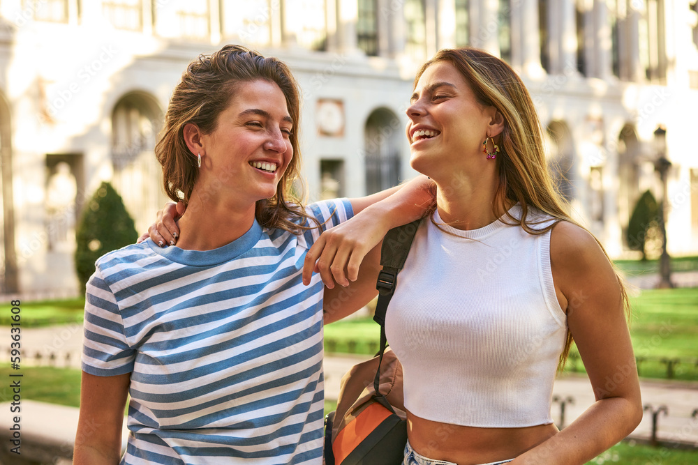 Two friends enjoy laughter and fun in a park. Two friends enjoy laughter and fun in a park.