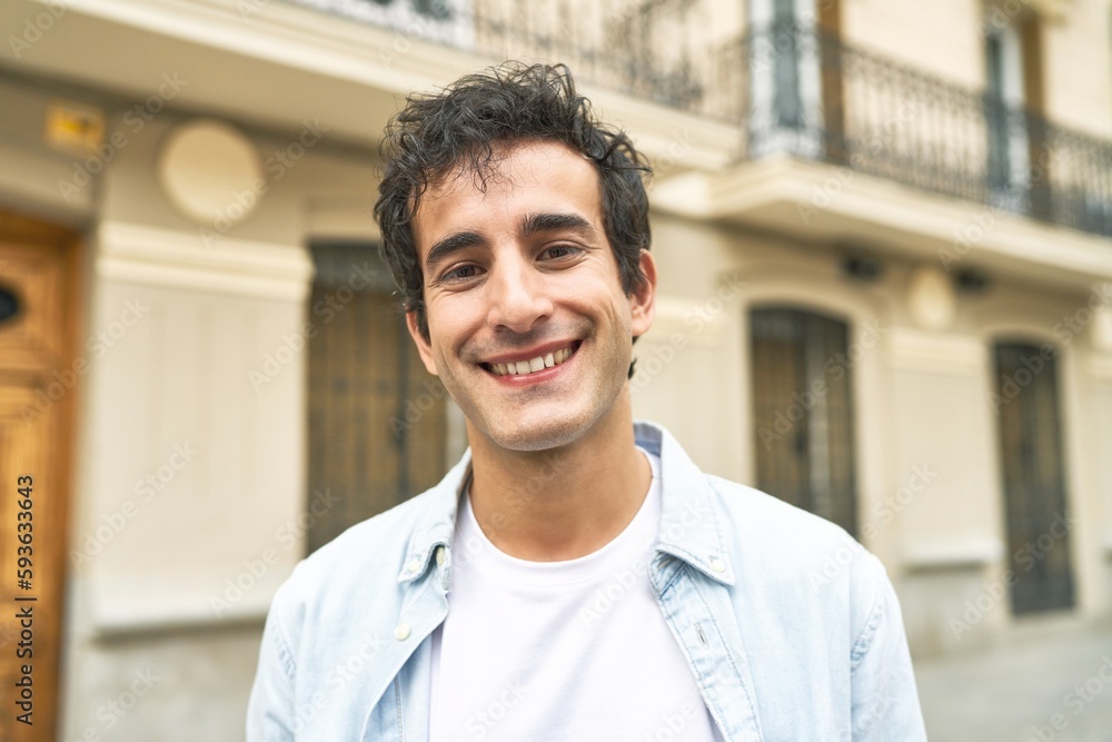 Fototapeta premium Young handsome caucasian man at outdoor happy, smiling and cheerful.