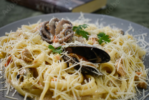 Dish of spaghetti allo scoglio, typical italian pasta with seafood sauce, Mediterranean Cuisine
