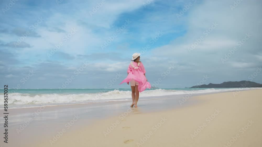 Beautiful elegant young woman celebrating summer vacation. Slow motion shot on RED camera girl having fun at tropical ocean beach. Girl enjoying sunny day on travel holiday. Perfect summer background Beautiful elegant young woman celebrating summer vacation. Slow motion shot on RED camera girl having fun at tropical ocean beach. Girl enjoying sunny day on travel holiday. Perfect summer background