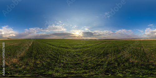 360 hdri panorama view among fields with sunset sky in golden hour in countryside with tractor tires in equirectangular seamless spherical projection. use like sky replacement for drone shots