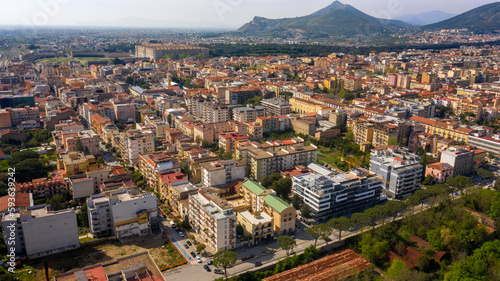 Aerial view of the historic center of Caserta, in Campania, Italy. In background the Royal Palace of Caserta also known as Reggia di Caserta, symbol of the city.
