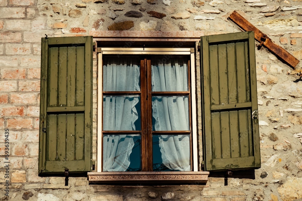 Old window on the stony building Old window on the stony building