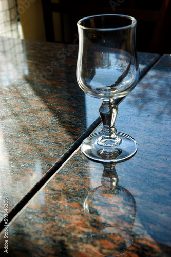 Fotografie Reflection of  empty glass in marble table