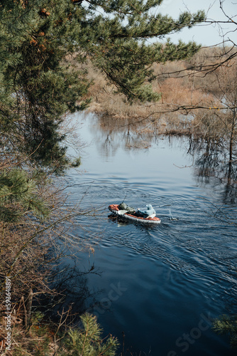 View of tourist kayaking a river