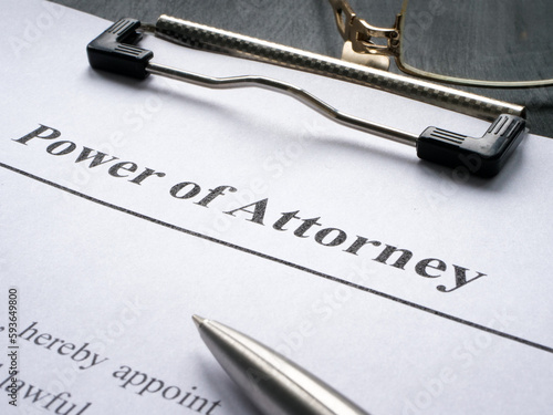 Clipboard with Power of attorney and pen for signing.