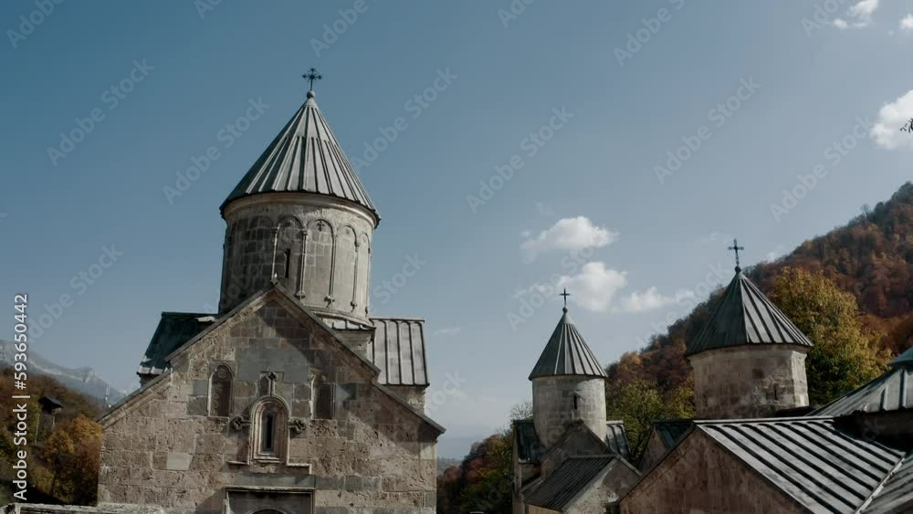 Aerial low angle view of Haghartsin monastery with blue sky, rounded with forest Aerial low angle view of Haghartsin monastery with blue sky, rounded with forest