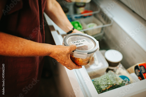 Putting away food in the freezer