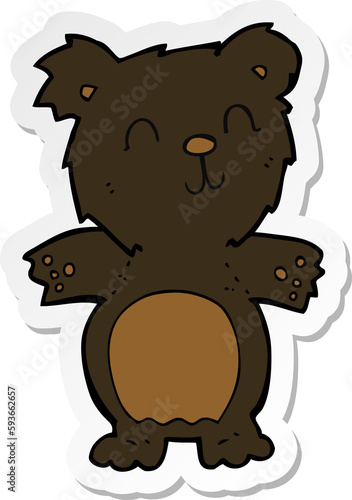 sticker of a cartoon cute black bear cub