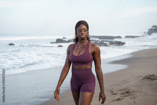 Woman at the beach dressed in sportswear