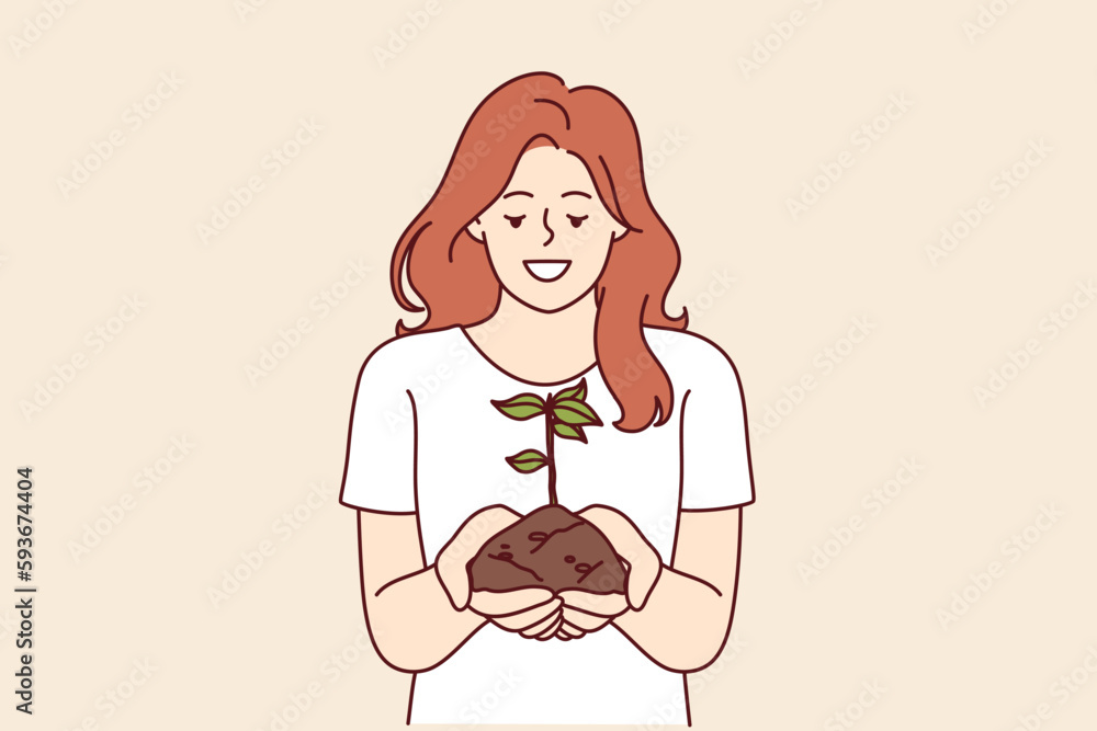 Woman holds handful of earth with plant drawing attention to problem of ecology and pollution or CO2 emissions. Happy girl doing plant cultivation and care for environment or ecology as volunteer Woman holds handful of earth with plant drawing attention to problem of ecology and pollution or CO2 emissions. Happy girl doing plant cultivation and care for environment or ecology as volunteer