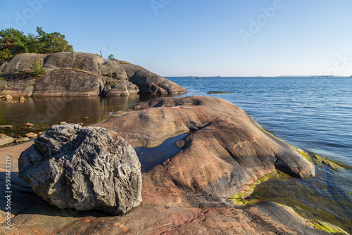 Beautiful rock, rocky coastline and shoreline cliffs at Puistovuori in Hanko, Finland, on a sunny day in the summer. photo