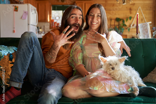 Happy couple engaged on couch