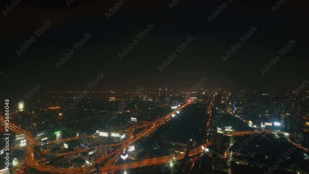 4K time-lapse aerial view of the city at night of traffic with a background of dense skyscrapers in the capital city. 4K time-lapse aerial view of the city at night of traffic with a background of dense skyscrapers in the capital city.