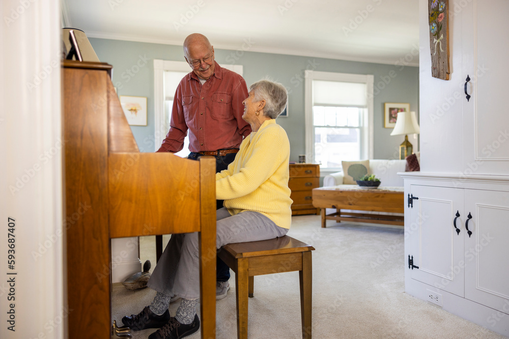 Afternoon Piano lessons for elderly senior fun couple connecting Afternoon Piano lessons for elderly senior fun couple connecting