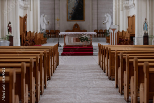 Horizontal image of empty old church with altar and wooden seats for different ceremonies