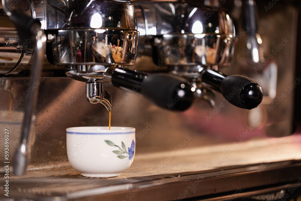 Professional barista preparing coffee. Young woman making coffee. Alternative ways of brewing coffee. Coffee shop concept