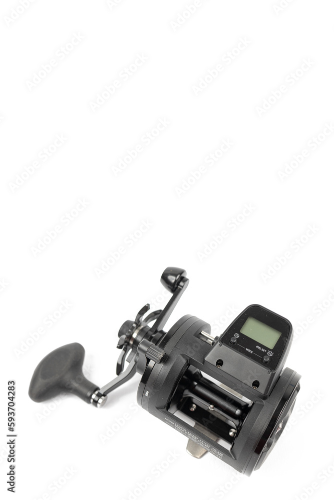 Naklejka premium Black fishing reel baitcast isolated above white background