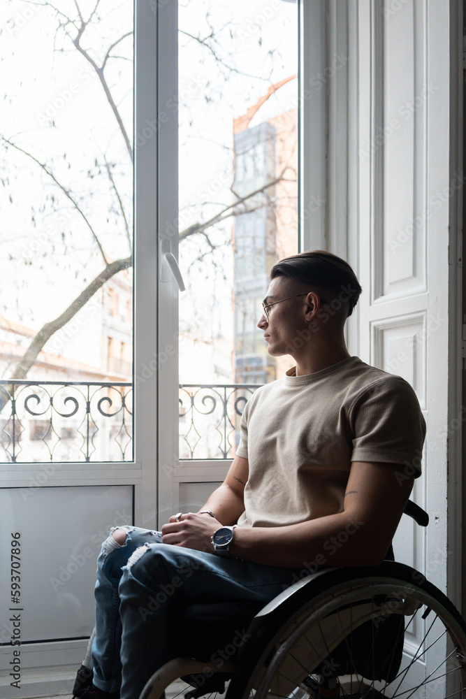 Young Man With A Disability Reading A Book Young Man With A Disability Reading A Book