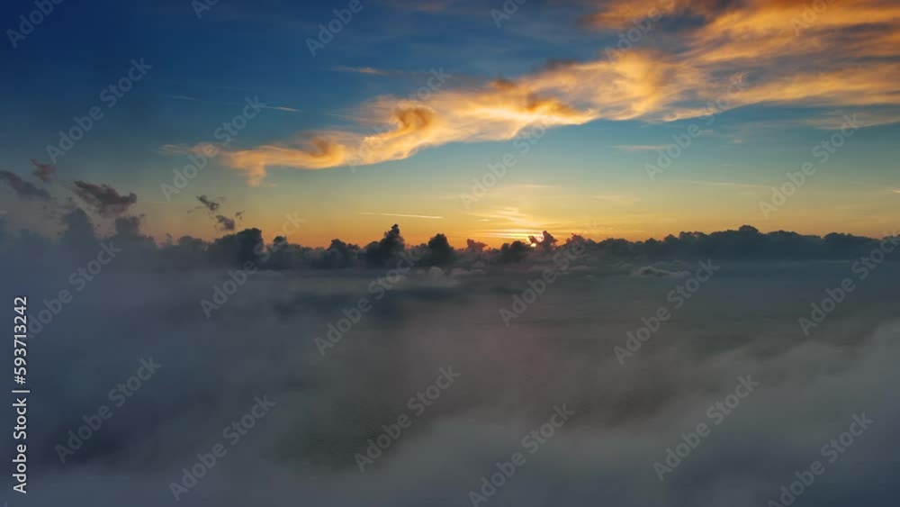 Aerial view of bright clouds over sea in bright sunset colors, 4k Aerial view of bright clouds over sea in bright sunset colors, 4k