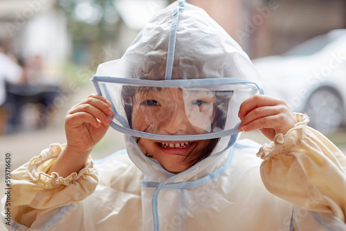 Asian girl wearing epidemic prevention clothing, smiling