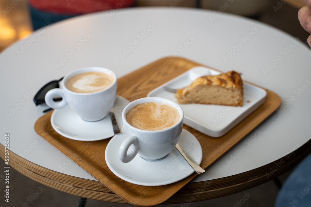 Coffee cup and cake at cafeteria Coffee cup and cake at cafeteria