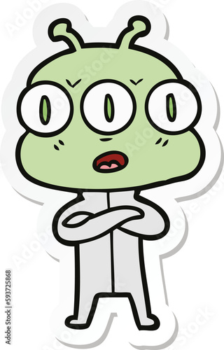 sticker of a cartoon three eyed alien