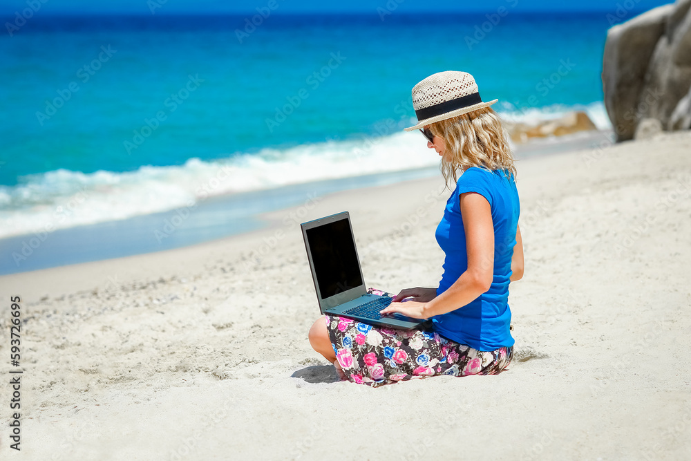 A Happy man girl with laptop near the seaside weekend travel