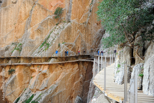 Hikers in the gorge of Los Gaitanes. Famous path of Caminito del Rey in Alora, province of Malaga, southern Spain, Europe photo