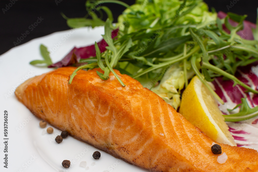 Beautiful red fish steak with lemon and herbs Beautiful red fish steak with lemon and herbs