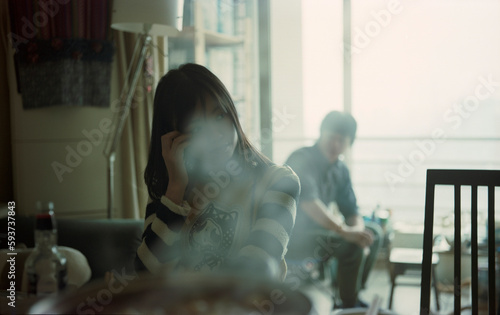 The girl sat in the smoke photo