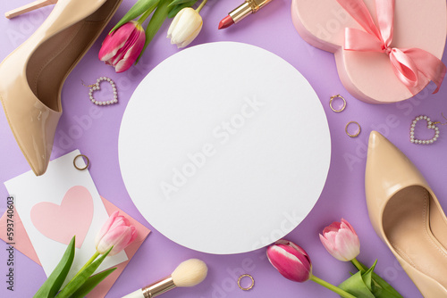 Celebrate Mother's day with this chic concept. Top view flat lay of high-heels, handbag, present box, tulips, makeup brush, and earrings on violet background with blank circle for text or advert