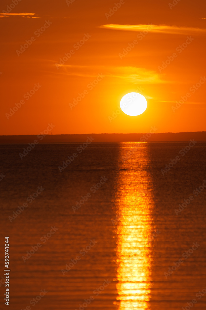 sunset on background of ocean or sea, beautiful orange color in nature. freedom and rest, observation and contemplation of view of the sun and sky. reflections of light play of waves sunset on background of ocean or sea, beautiful orange color in nature. freedom and rest, observation and contemplation of view of the sun and sky. reflections of light play of waves