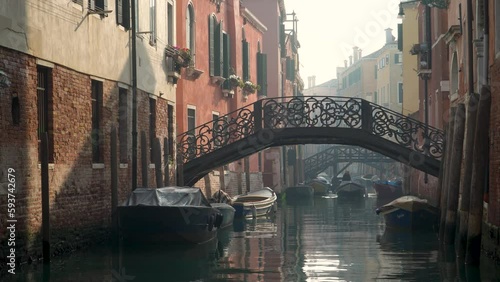 bridges and channels in venice on foggy winterday photo